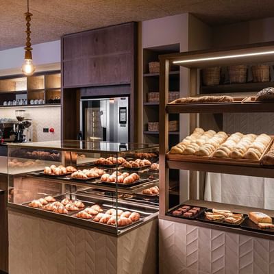 Baked products in shelves at Italian Bar, Falkensteiner Hotels