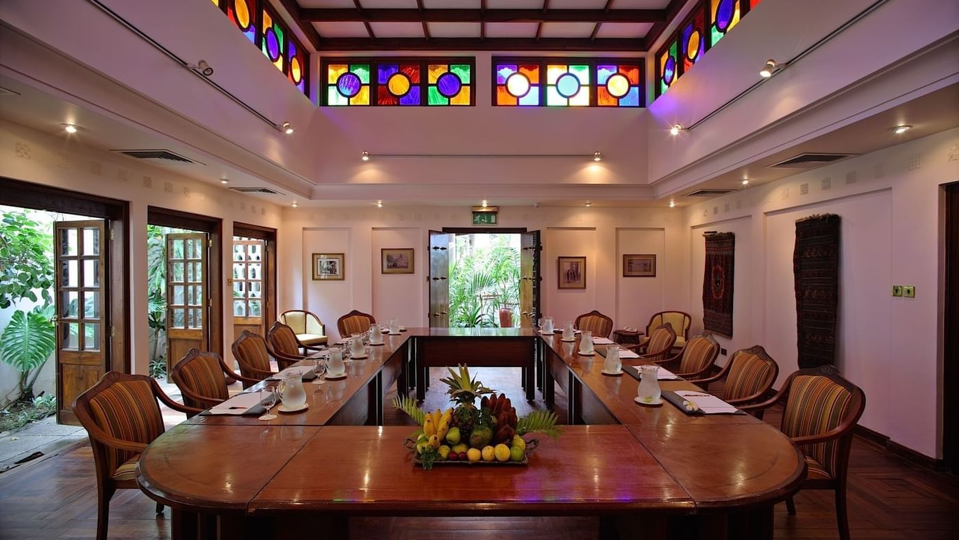 The Chaza Conference Room at Zanzibar Serena Hotel in Zanzibar is set with a large table and chairs.