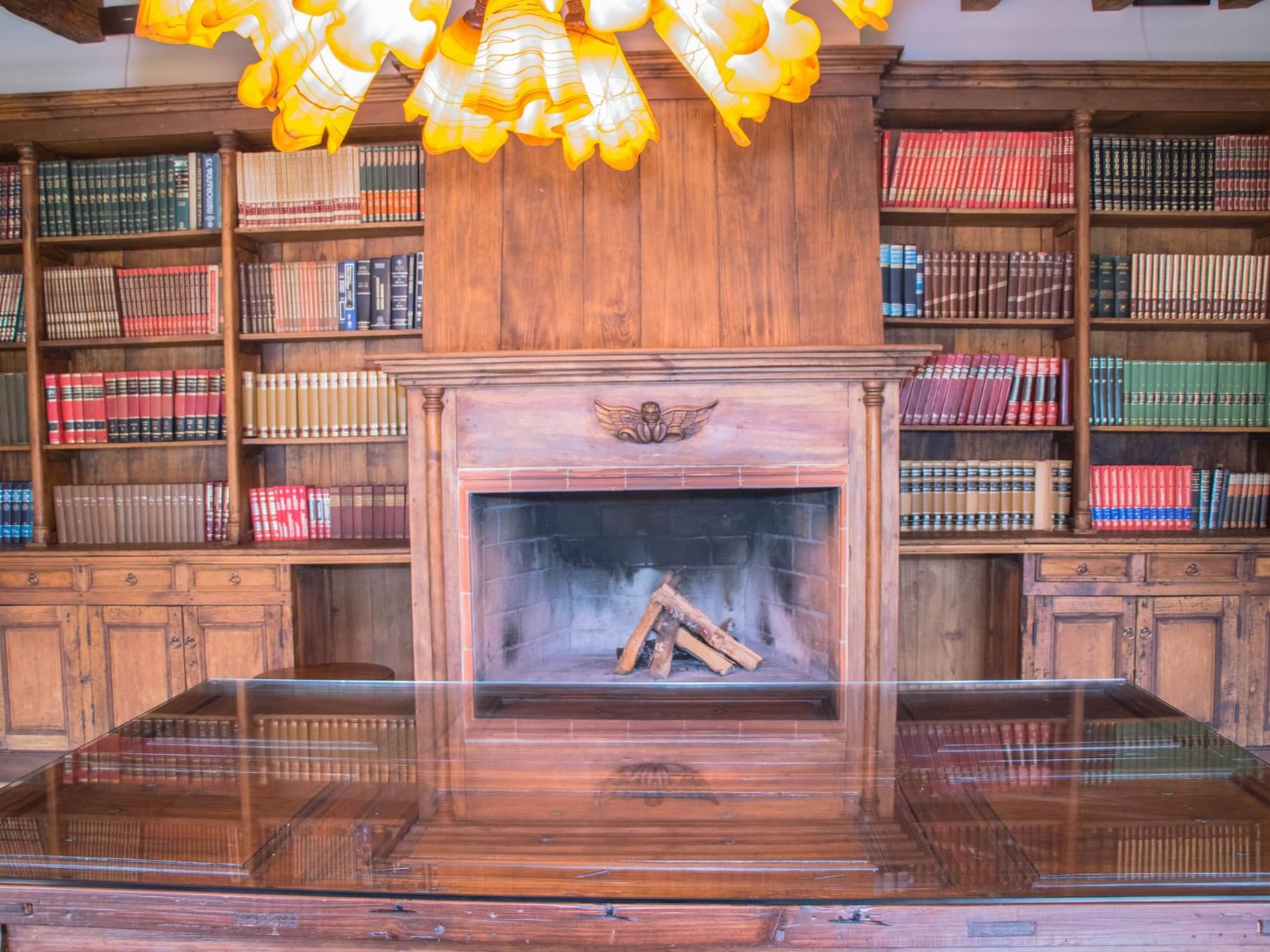 Book shelves & fire place in a Business Center at Gamma Hotels