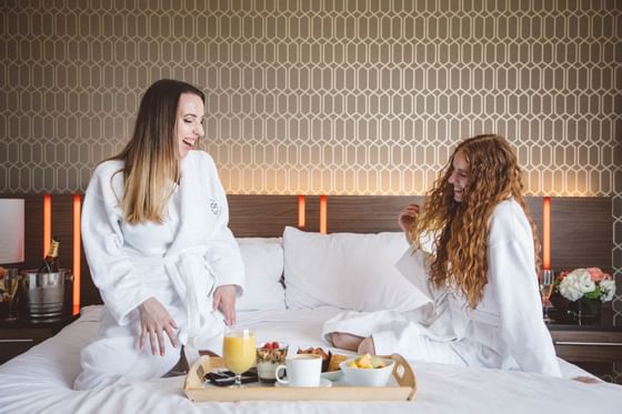 Two women enjoying room service at Hotel Angeleno