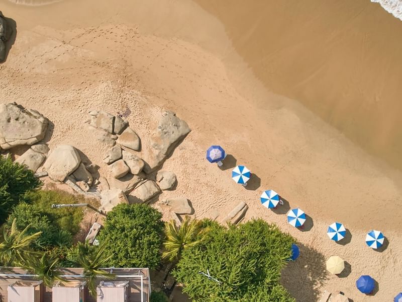 Aerial view of a beach with umbrellas near Fiesta Americana