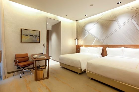 Interior of The Orchid Villa bedroom at One Farrer Hotel