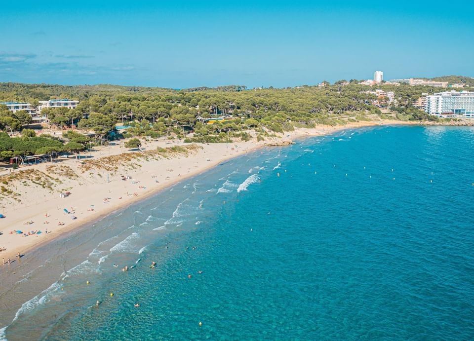 Aerial view of Platja Llarga beach & blue ocean near Hotel Vila Centric