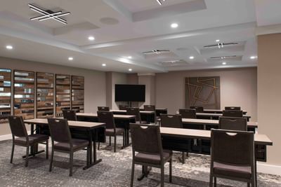 Classroom set-up in a meeting room with carpeted floors at Portland Harbor Hotel