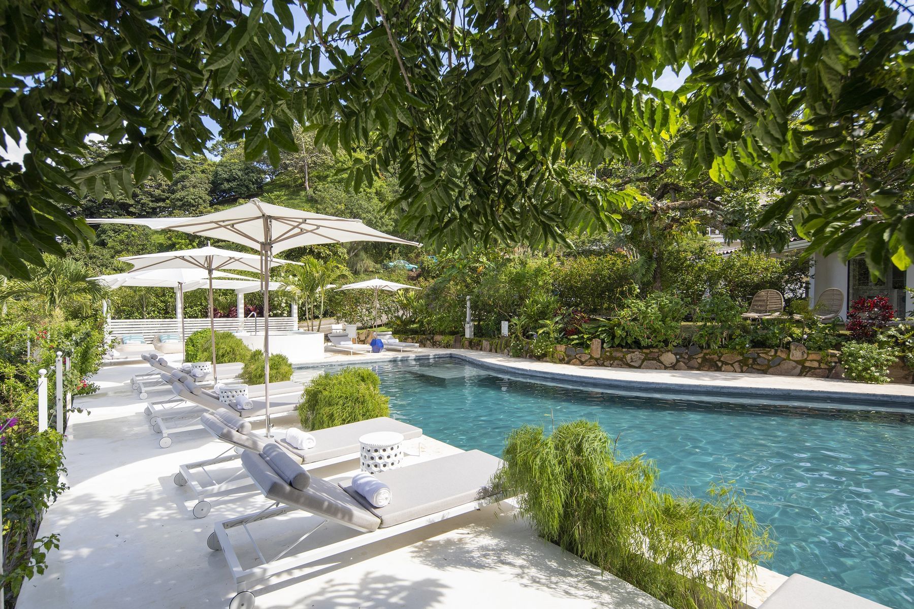 Pool beds by the outdoor pool at Retreat Costa Rica