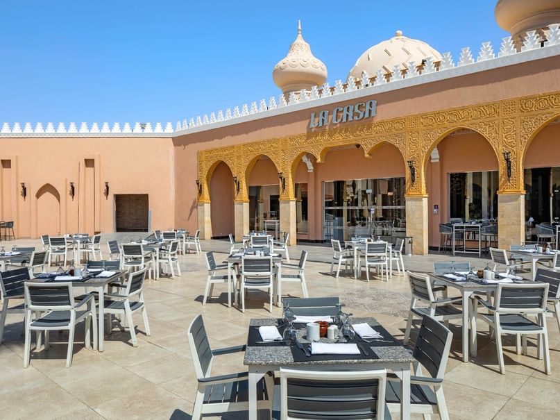 La Casa restaurant with many tables and chairs in front of building at Neverland City Hurghada in Hurghada.