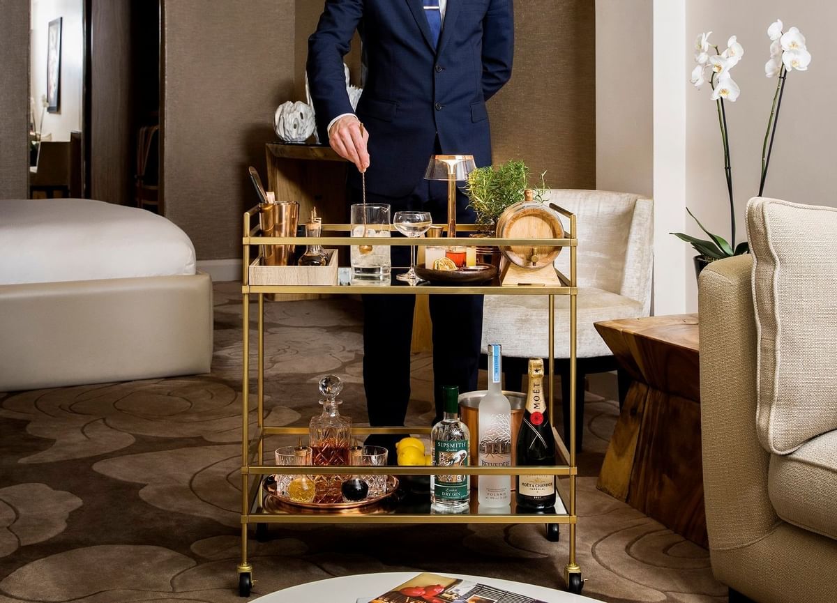Butler making a cocktail at The May Fair Hotel London