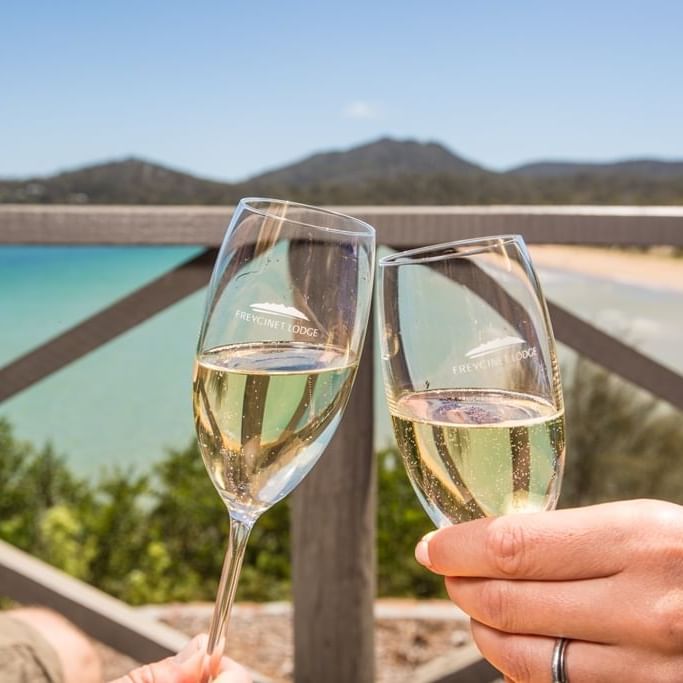 Close up on two champagne glasses at the Freycinet Lodge