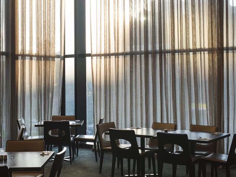 Dining tables arranged in Mr.Hive Kitchen & Bar at Crown Hotels