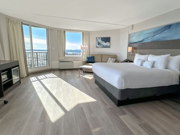 Hotel guestroom with a king bed