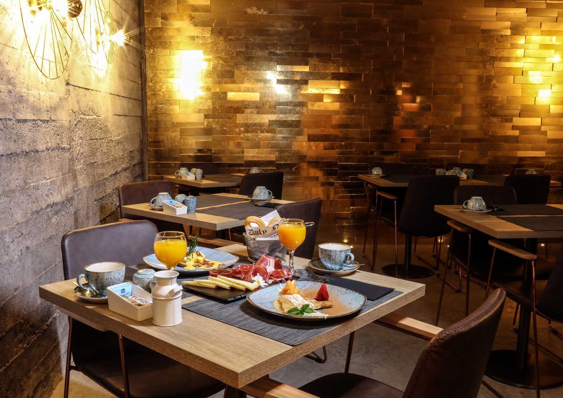 Food served in the dining area at Design Plus Bex Hotel