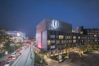 Night time exterior view of U Hotels & Resorts