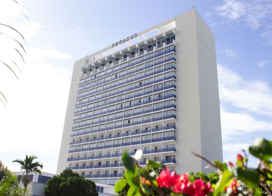 Exterior low-angle view of the Jamaica Pegasus Hotel building near Courtleigh Hotel & Suites
