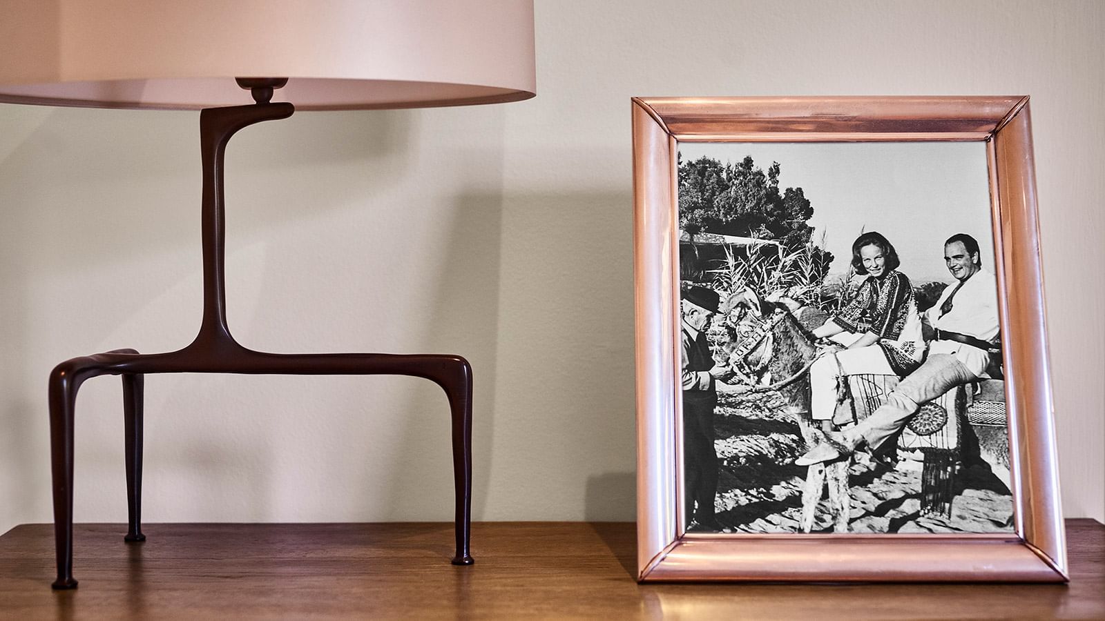 Framed vintage B&W photo of guests on a donkey, showcasing Marbella Club history in Conde Rudi at Marbella Club