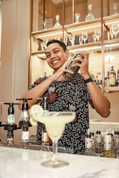 Barista making drinks in Pelangi Lounge at Pelangi Beach Resort
