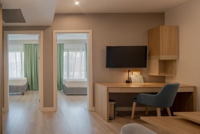 Two Separating bed areas with workspace and TV in Interconnected Suites at The Hub Acunmeyda