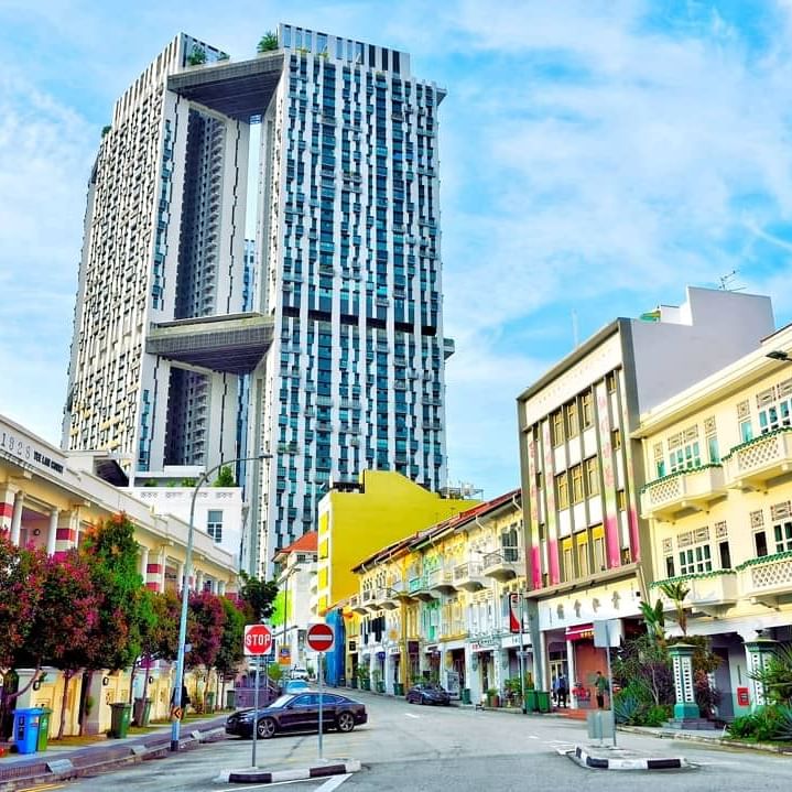 View of a street surrounded with buildings near Amara Hotels