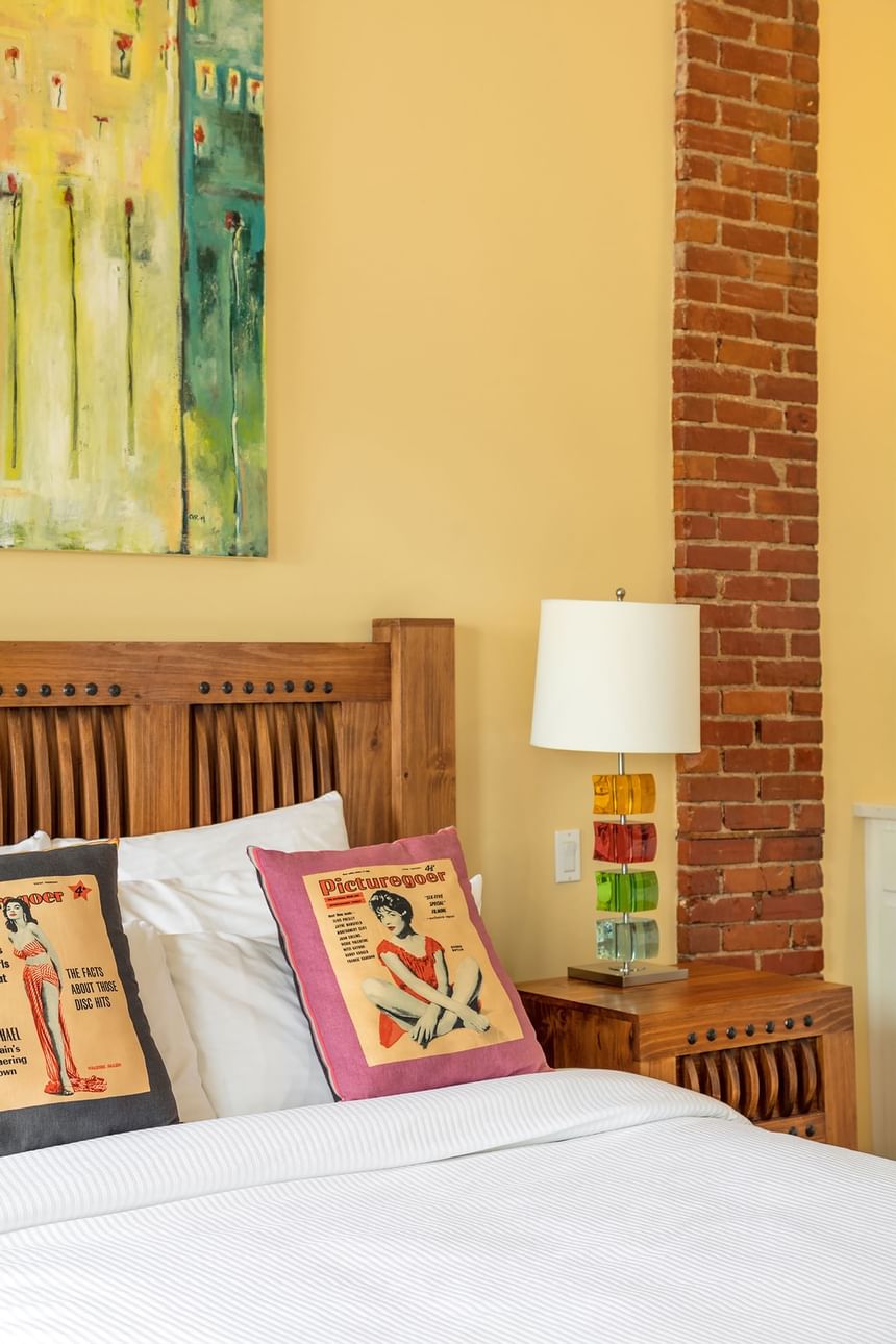 queen bed in mellow with blue and yellow original artwork 