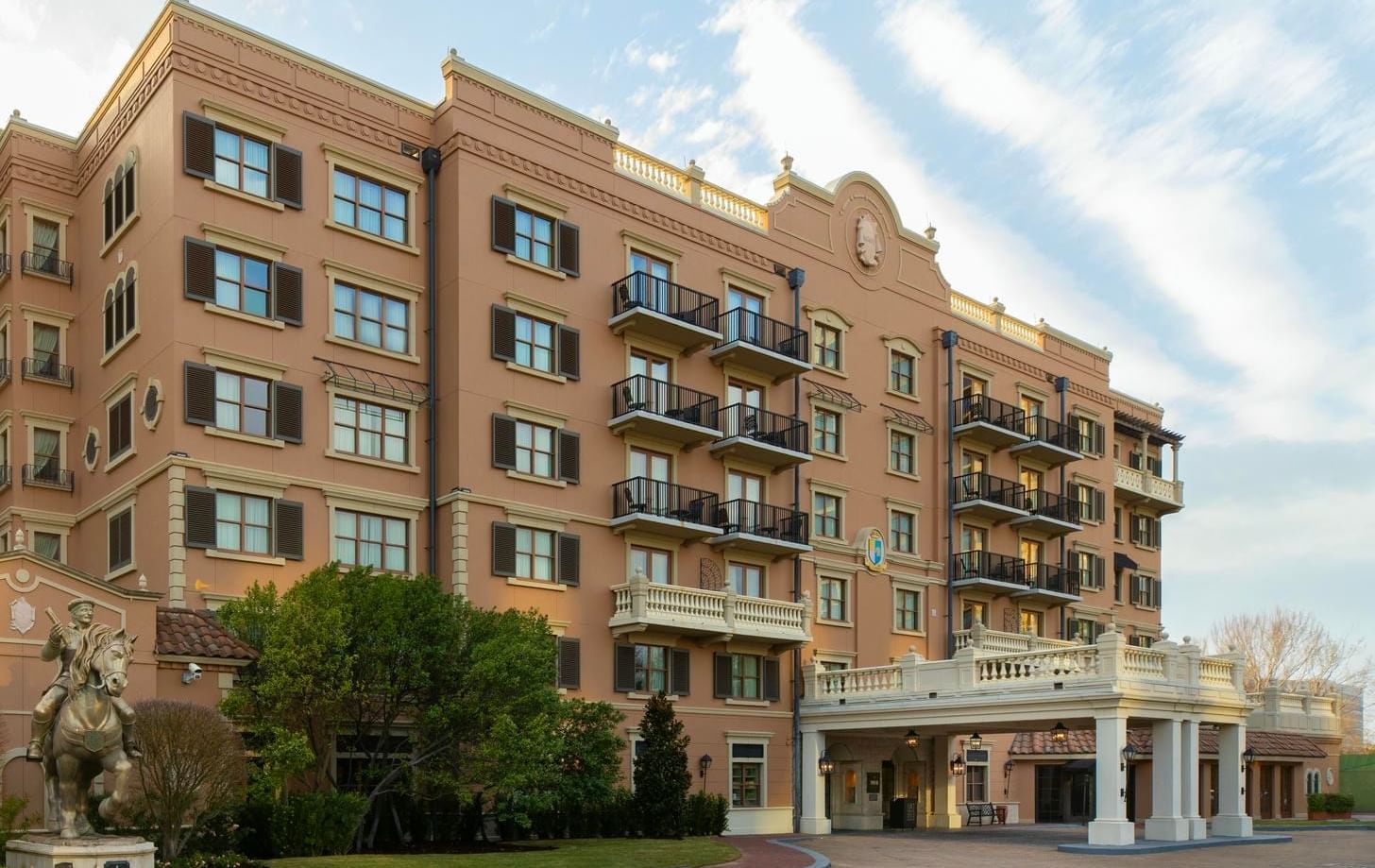 Elegant exterior of Granduca Houston, one of the top Houston luxury hotels, with cavalryman statue at entry