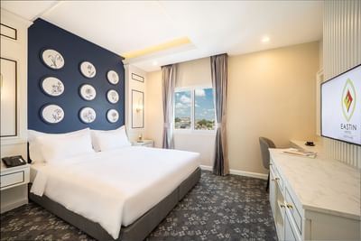 TV stand facing the king bed in Superior City View at Eastin Vientiane Laos