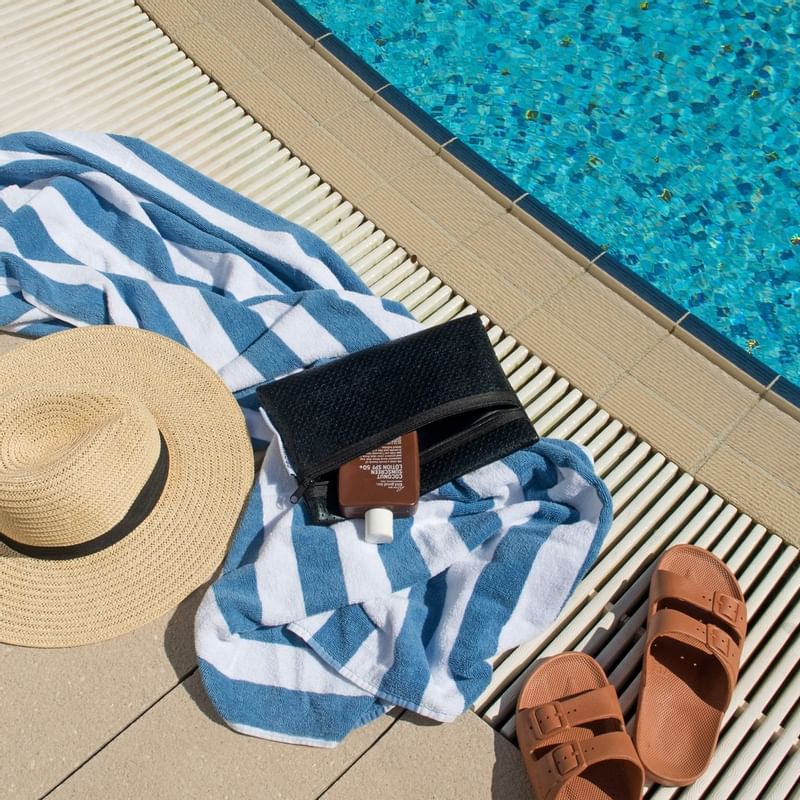 Hat & towel near the pool at Crown Metropol Perth