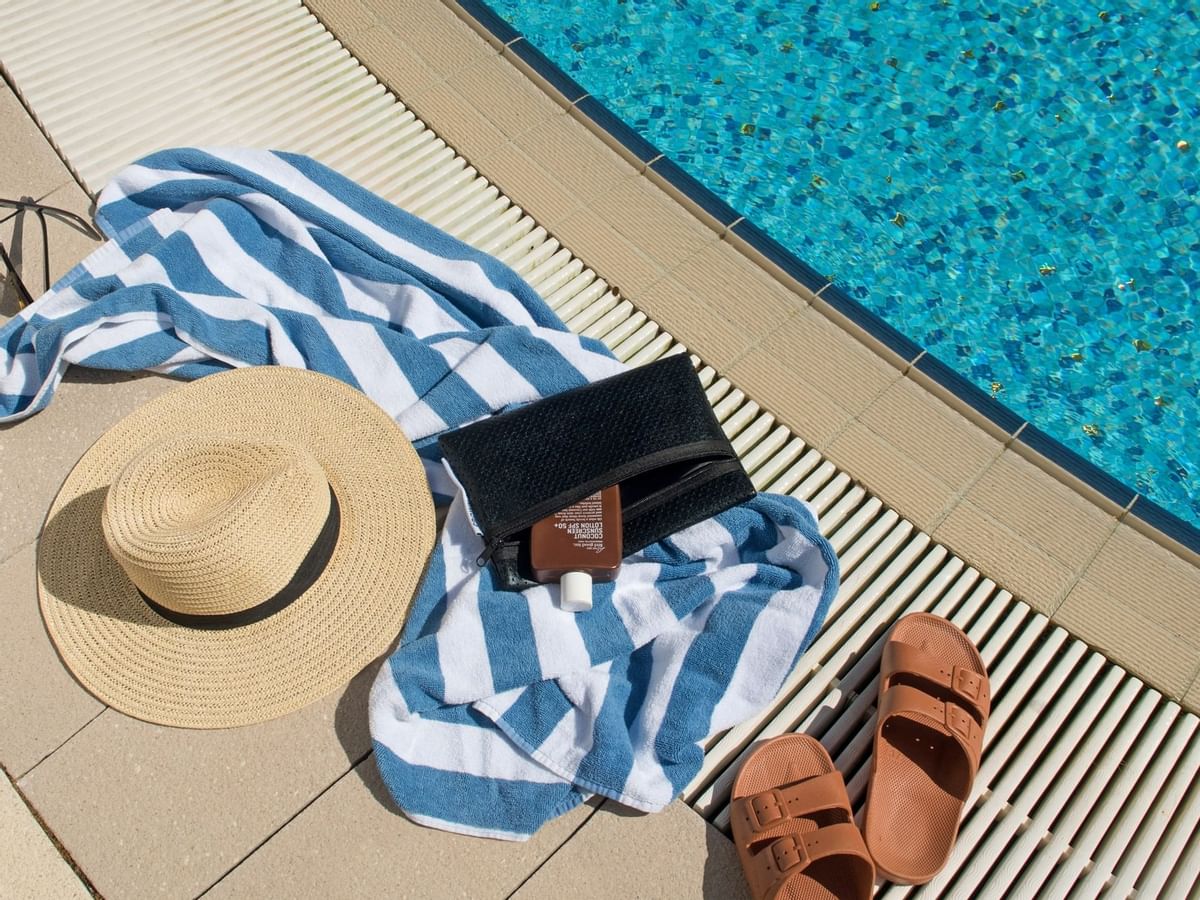 Hat & towel near the pool at Crown Metropol Perth
