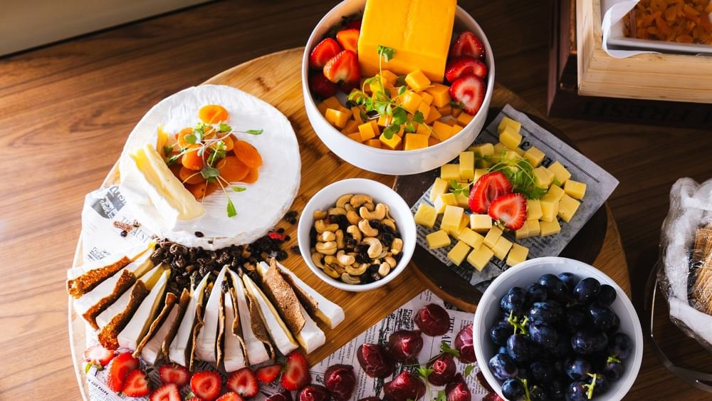 Cheese, crackers, and fruit arranged on a platter served in The Lounge at Novotel Sydney Olympic Park