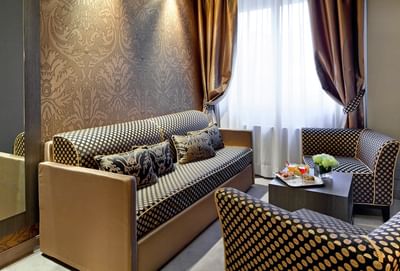 Interior of a living room in Junior Suite at Hotel Mozart Milan