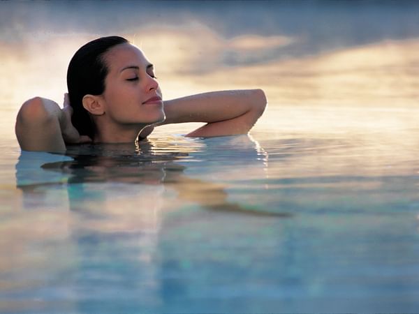 Lady relaxing in the water at Safety Harbor Resort & Spa