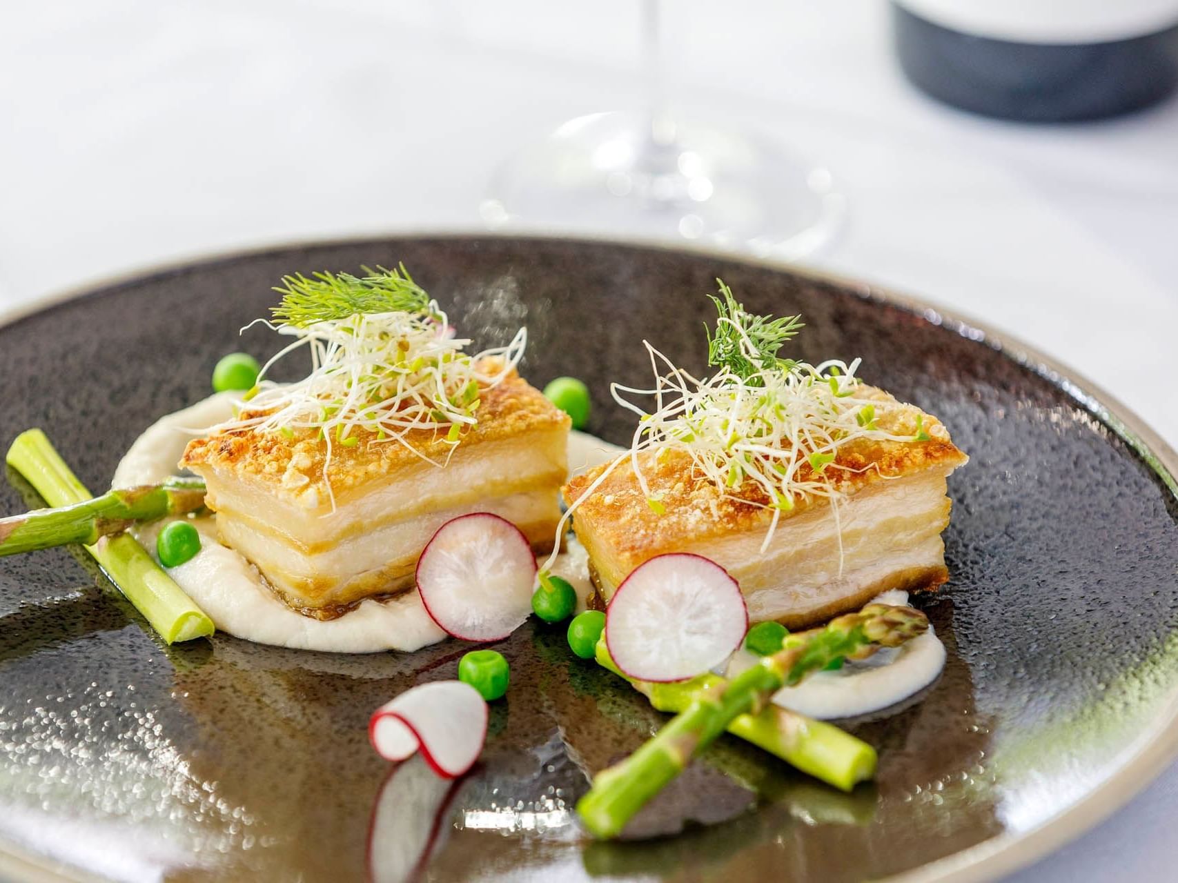 Close-up of belly pork dish served at Grand Chancellor Melbourne