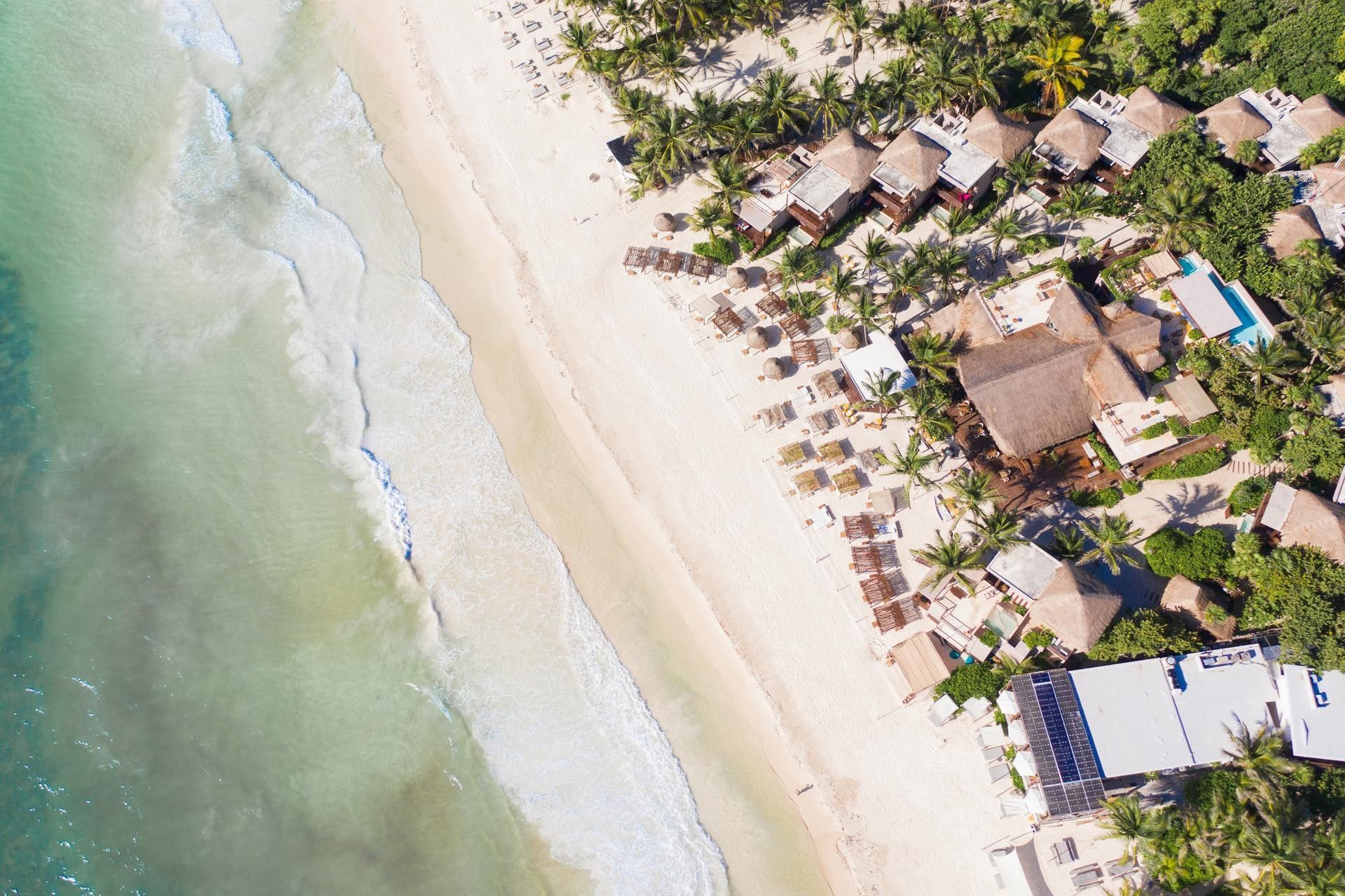 Aerial view of La Zebra Tulum on a white-sand Caribbean beach