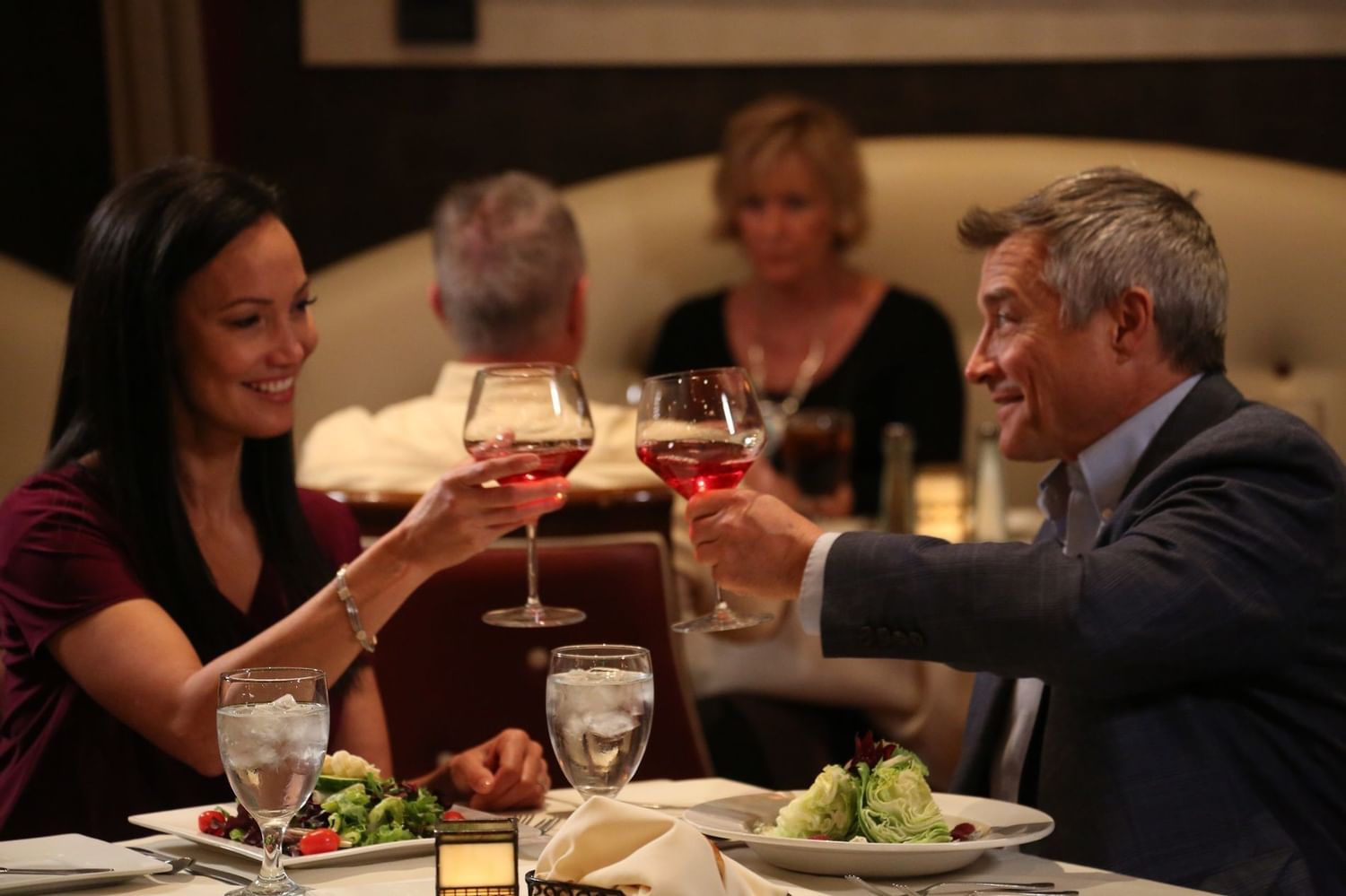 Guests toasting with glasses of wine