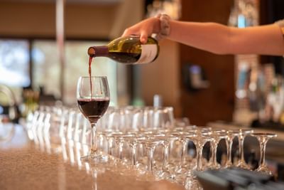 Close-up of pouring wine at The IowaStater Restaurant