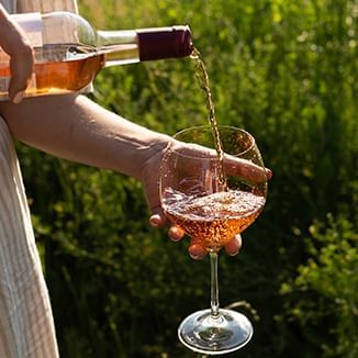 pouring rose wine into a wine glass