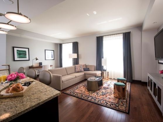 Living area with TV in Unit C at The Mayo Hotel