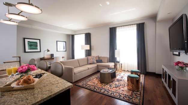 Living area with TV in Unit C at The Mayo Hotel