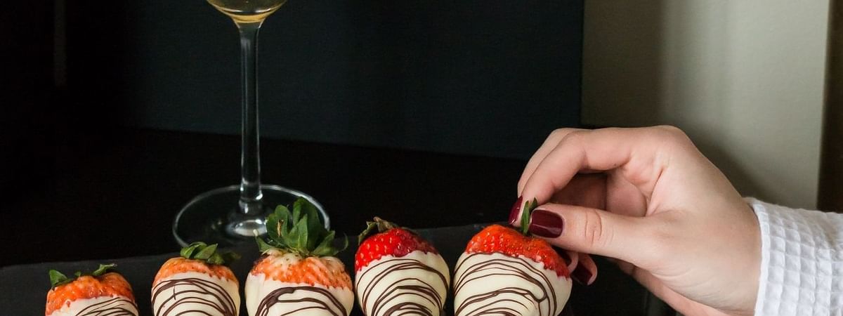 Champagne and chocolate-dipped strawberries served at The May Fair Hotel