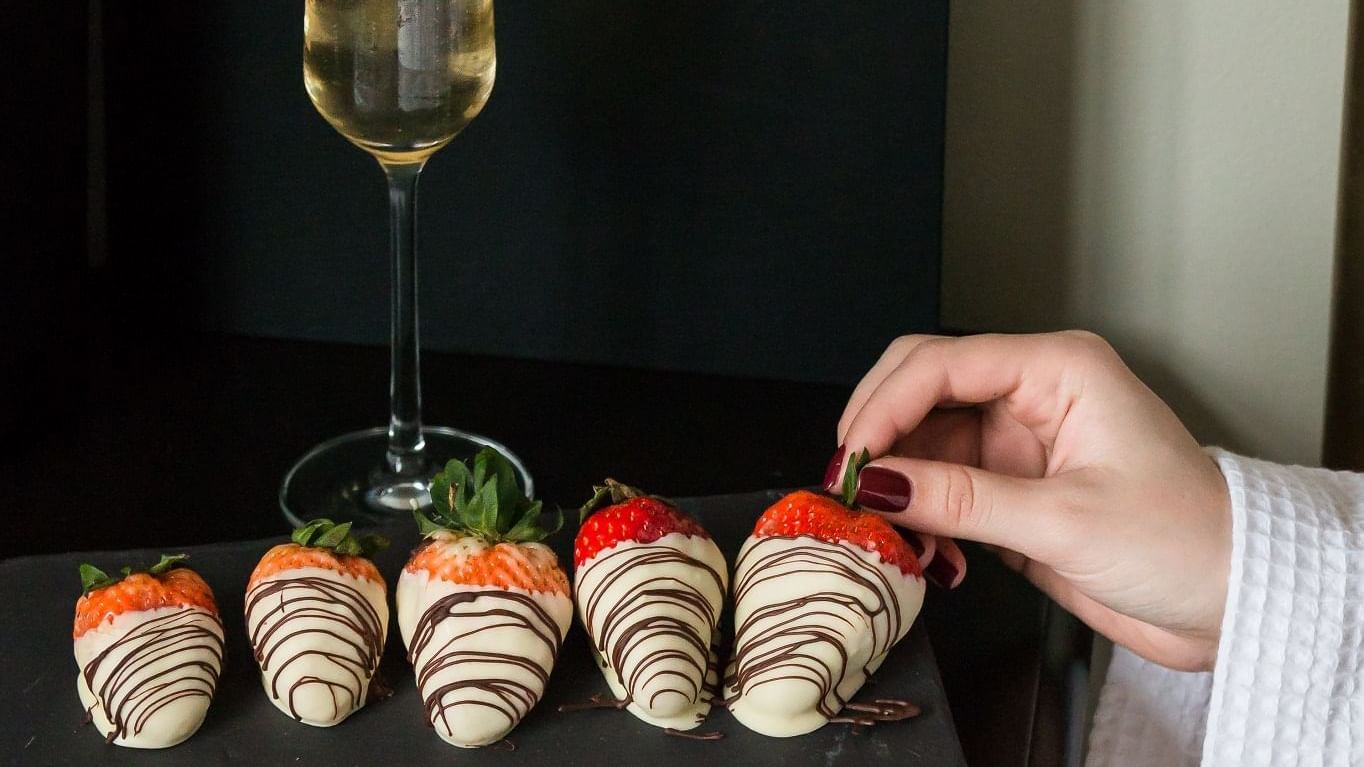 Champagne and chocolate-dipped strawberries served at The May Fair Hotel