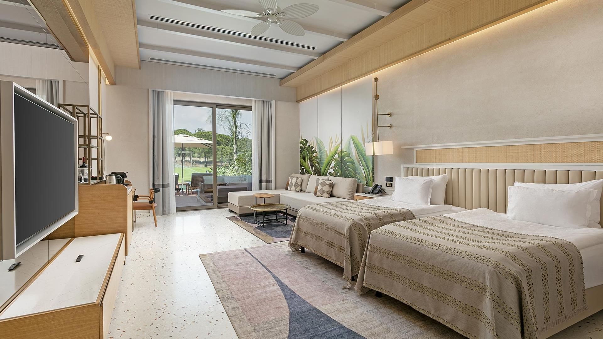 TV & seating area by the bed in Lagoon Golf Family Swim-up at Cullinan Belek