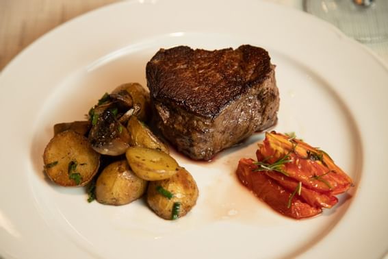 Steak dish served at Hotel Emperador Buenos Aires