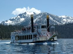 Tahoe Gal paddle wheel cruise on Lake Tahoe with snowy peak in background