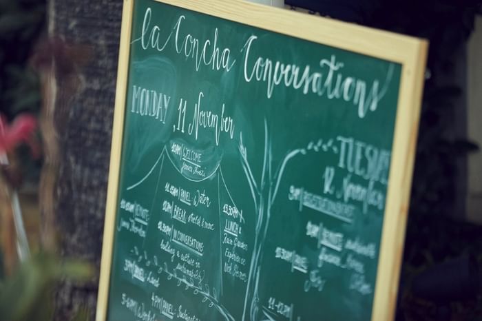 Chalkboard displaying the La Concha Conversations event schedule for Monday, 11 November at Marbella Club