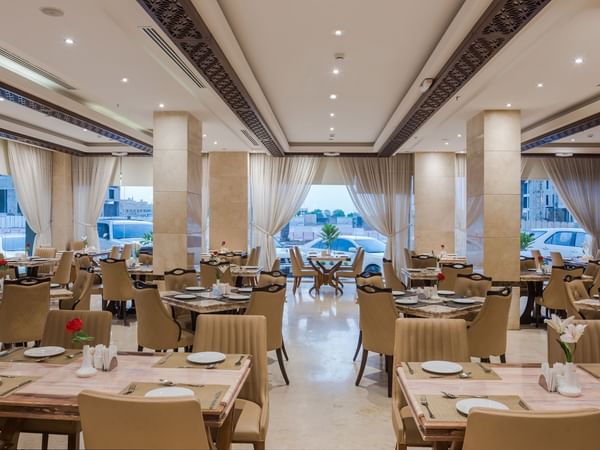 Modern restaurant interior with dining table set up at Naviti by Warwick Al Khobar