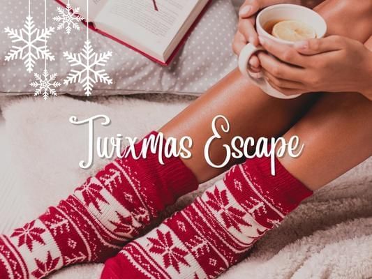 Women wearing festive socks on hotel bed