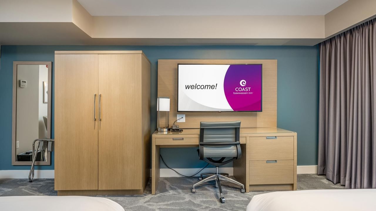Work desk and tv in our Coast Accessible Two Queens Bedroom