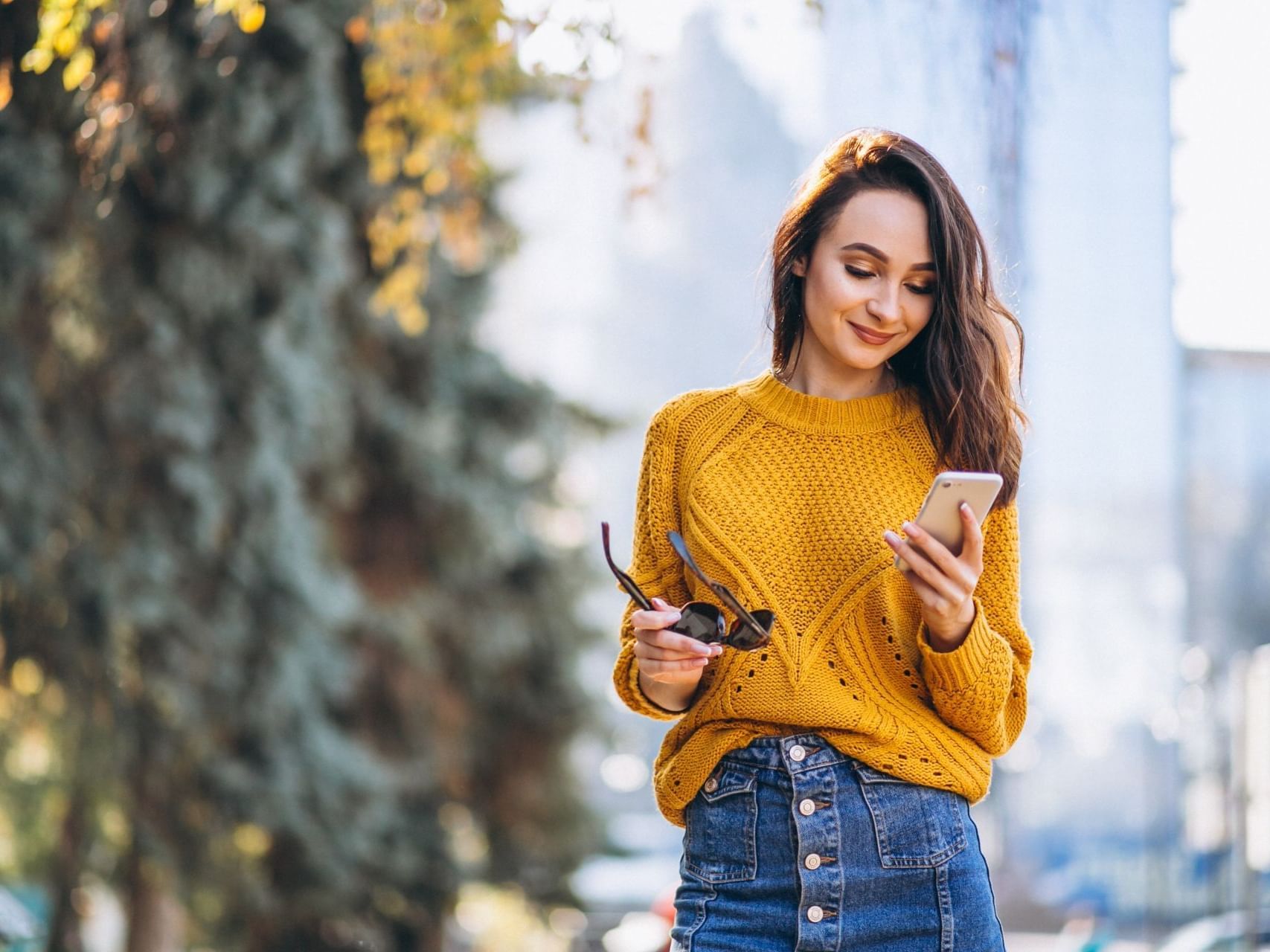 Closeup of a girl looking at her phone at Hotel Torremayor Lyon