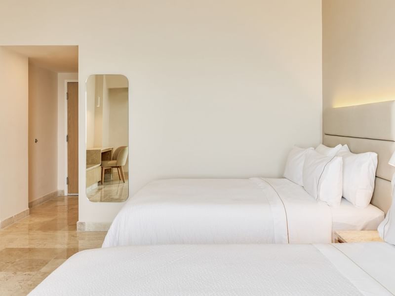 Deluxe Superior Room , 2 Double with two beds and wall mirror at Fiesta Inn