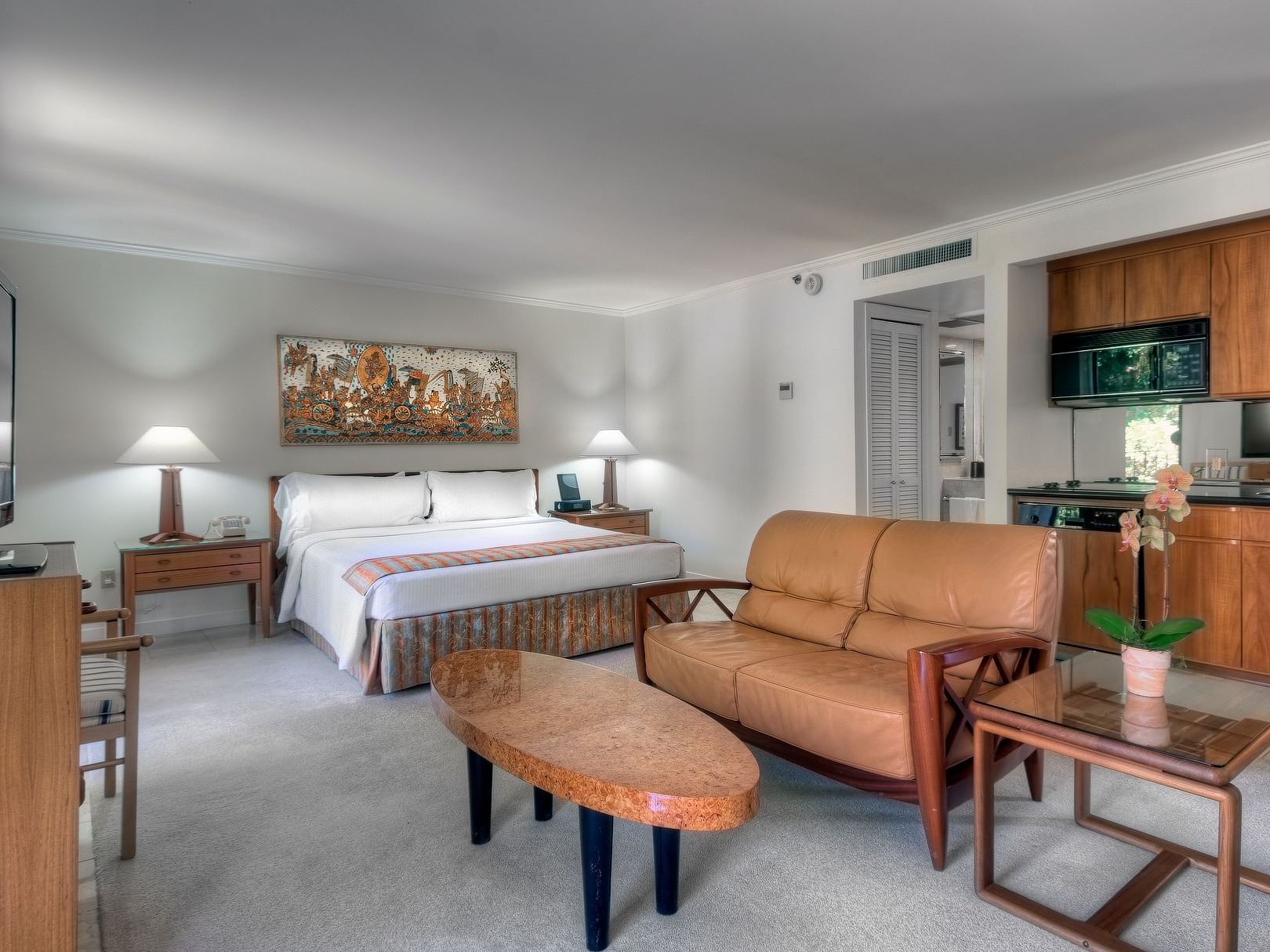 bed on carpeted floor with furniture