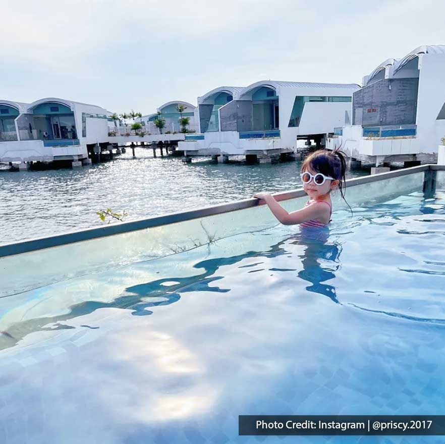 Girl having fun by the poolside