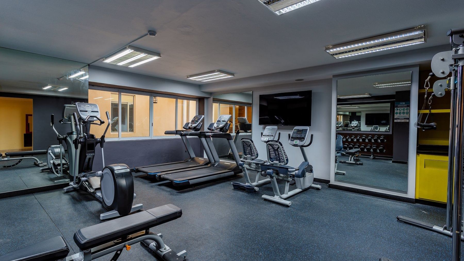 Exercise machines in a gymnasium at Gamma Hotels